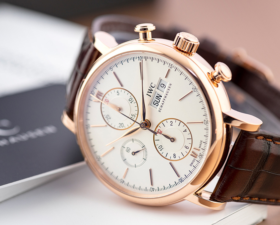 IWC Schaffhausen watch with brown leather strap watch face close up