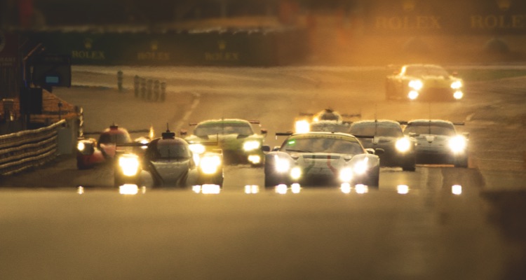 Le-Mans motorsports track with sports cars driving