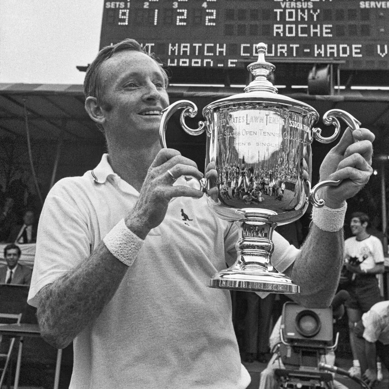 Black and white shot of Rod Lever holding Rolex US Open trophy