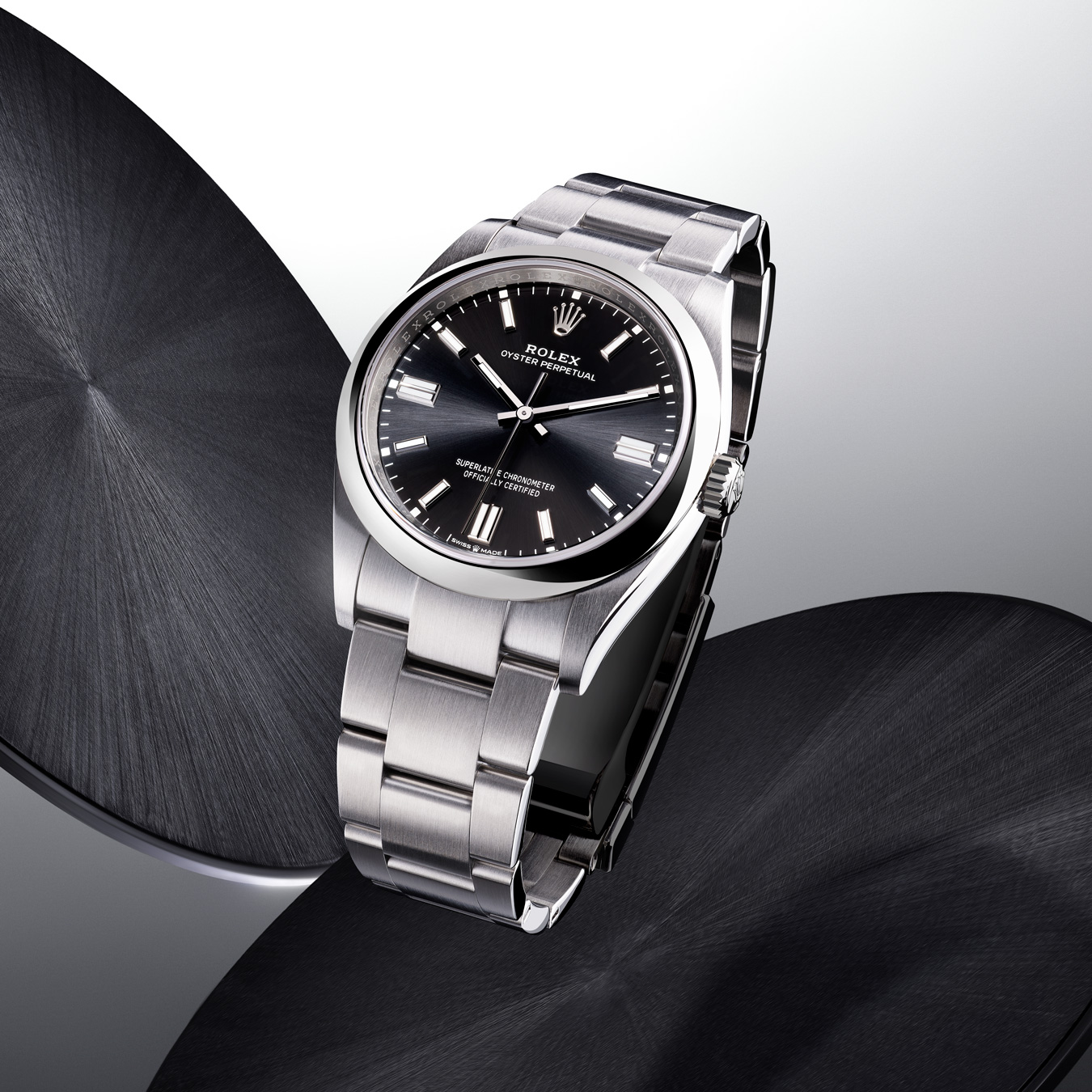 Silver Rolex Oyster Perpetual with link strap and black dial