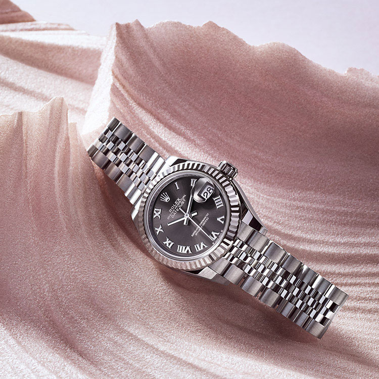 Silver Rolex Lady Datejust watch with black dial