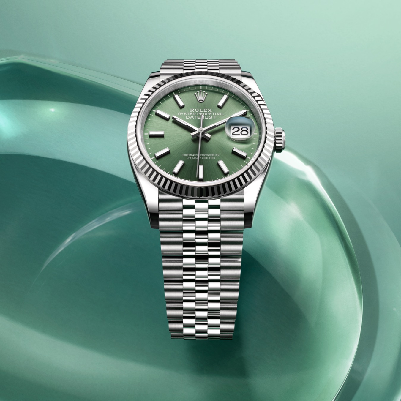 Silver Rolex Oyster Perpetual Datejust with link strap and green dial
