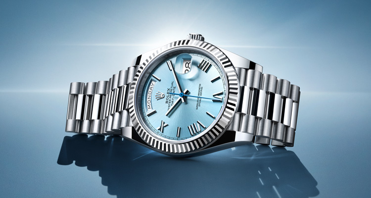 Silver Rolex Oyster Perpetual with link strap and light blue dial
