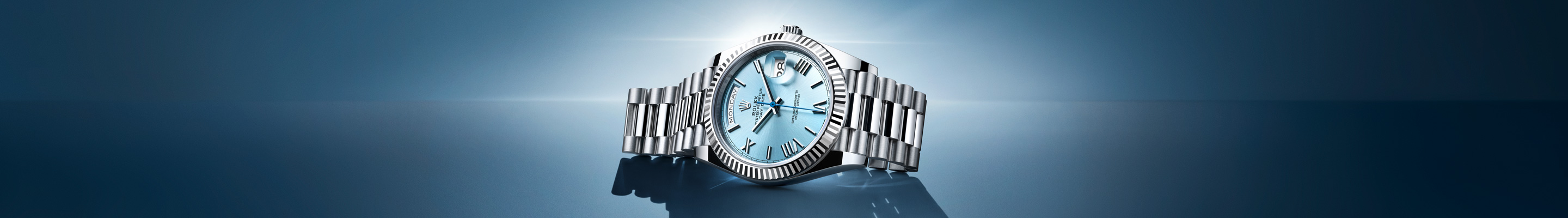 Silver Rolex Oyster Perpetual with link strap and light blue dial
