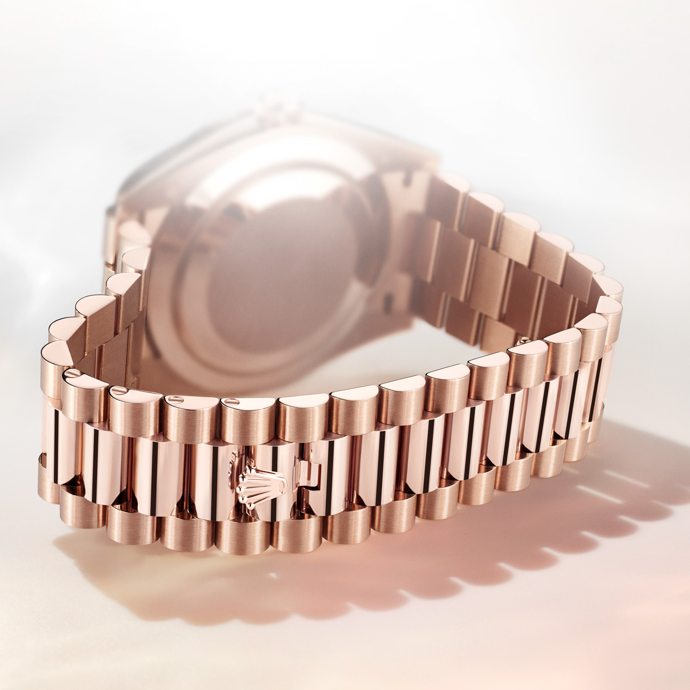 Rose gold link strap with Rolex detailing