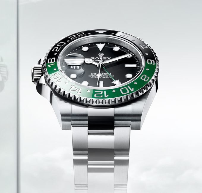 Rolex Oyster Perpetual silver watch with green and black dial detail