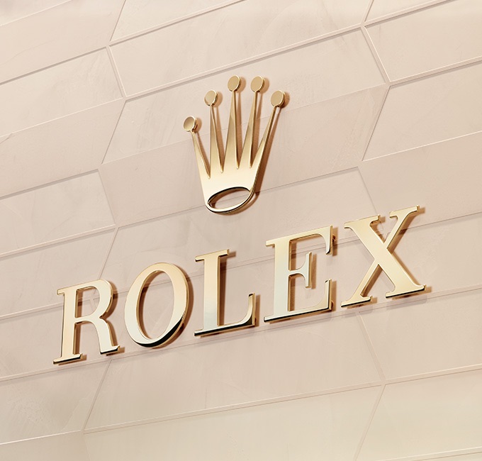 Luxury gold Rolex logo on gold background