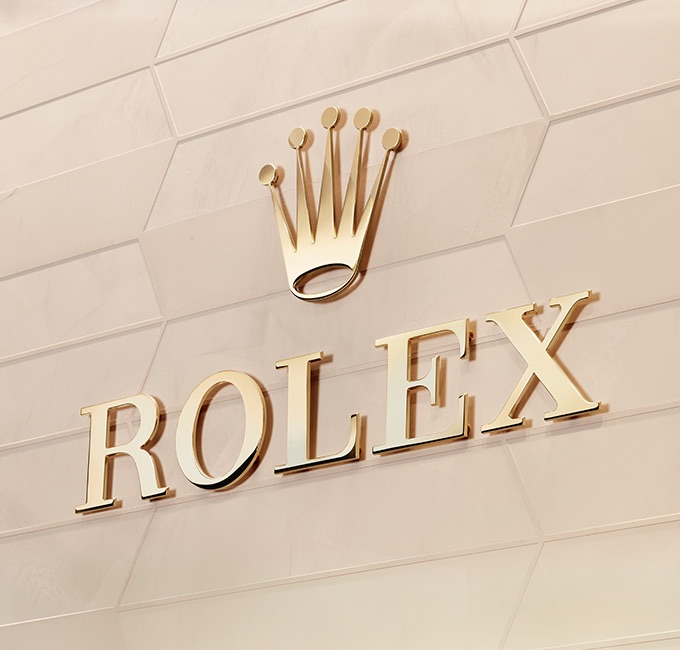 Luxury gold Rolex logo on gold background