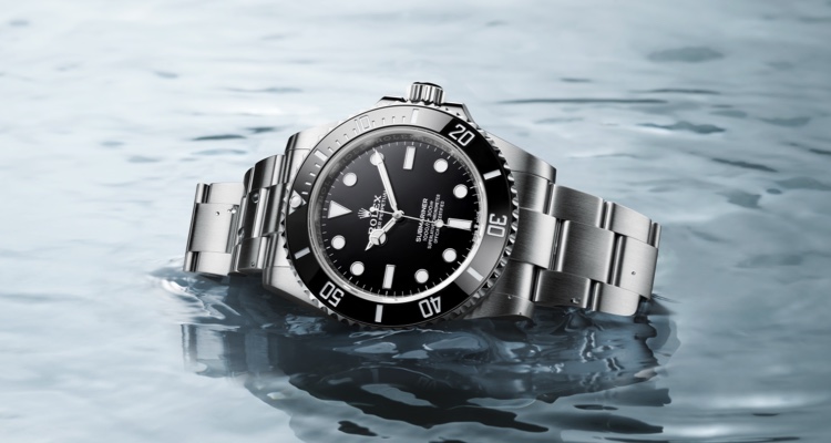 Silver Rolex Oyster Perpetual with black dial in water