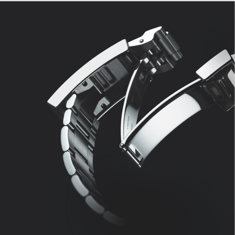 Silver Rolex watch fastening on black background