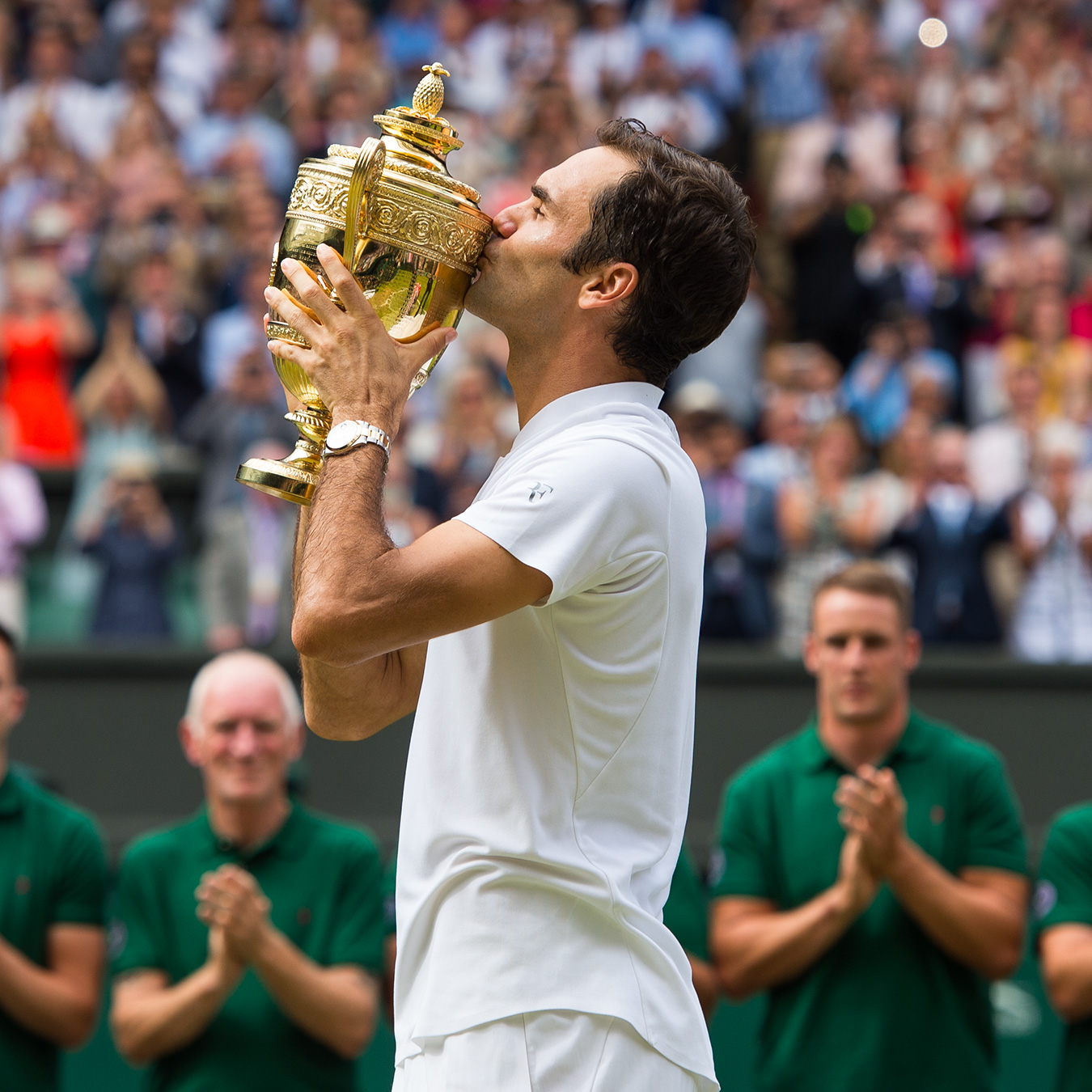 Roger Federer winning Wimbledon trophy
