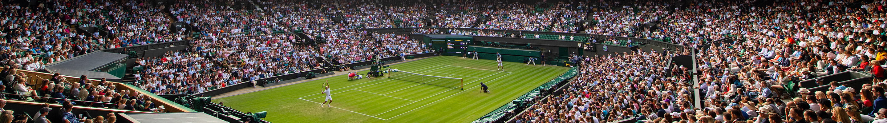 Tennis player serving at Wimbledon tournament banner