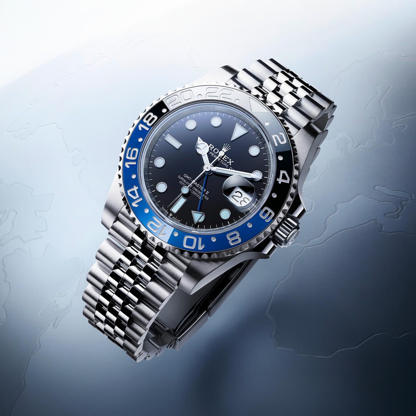 Silver Rolex watch with black dial and link strap
