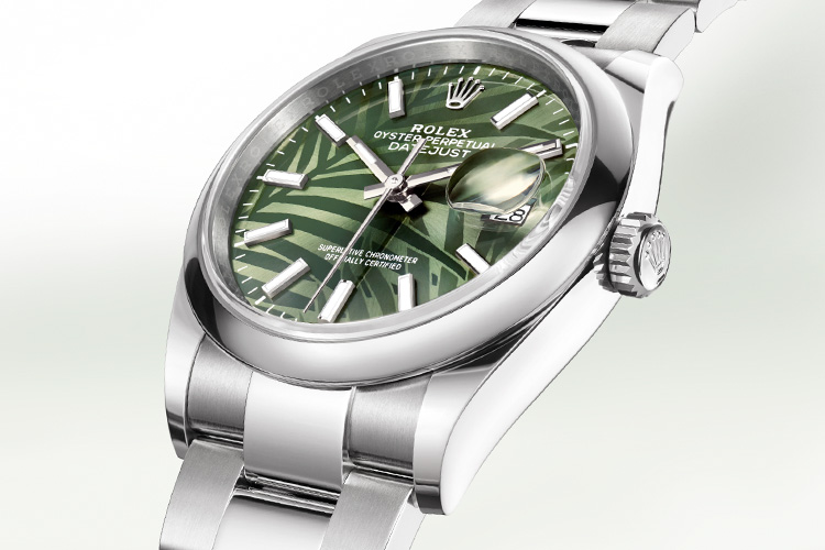 Rolex Datejust silver watch with vibrant green dial