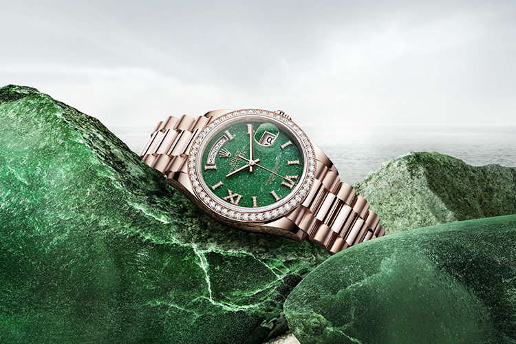 Rose gold Rolex watch with green dial and diamond detail