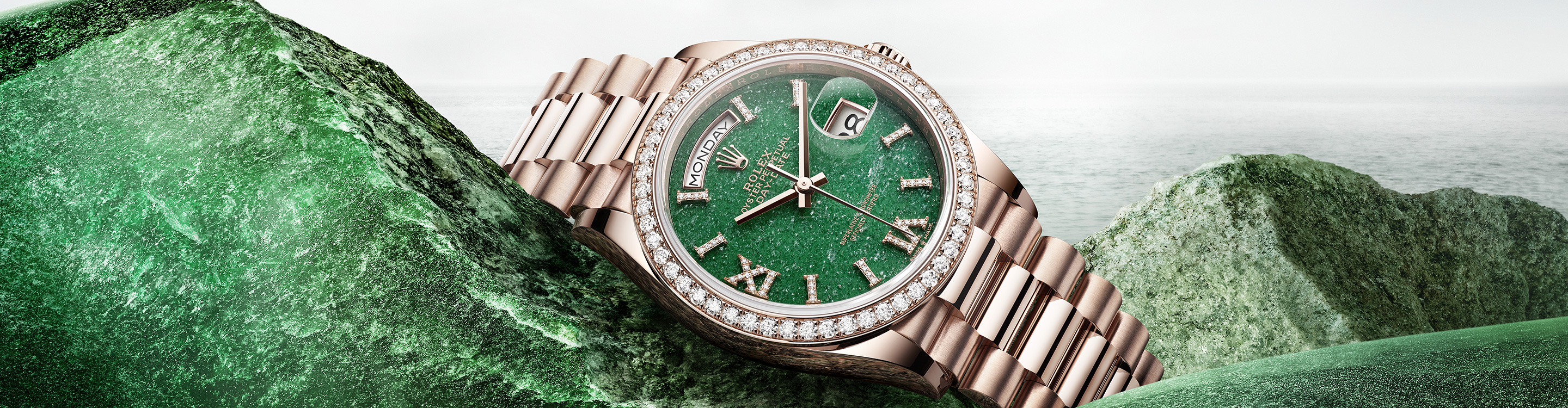 Rose gold Rolex watch with green dial and diamond detail