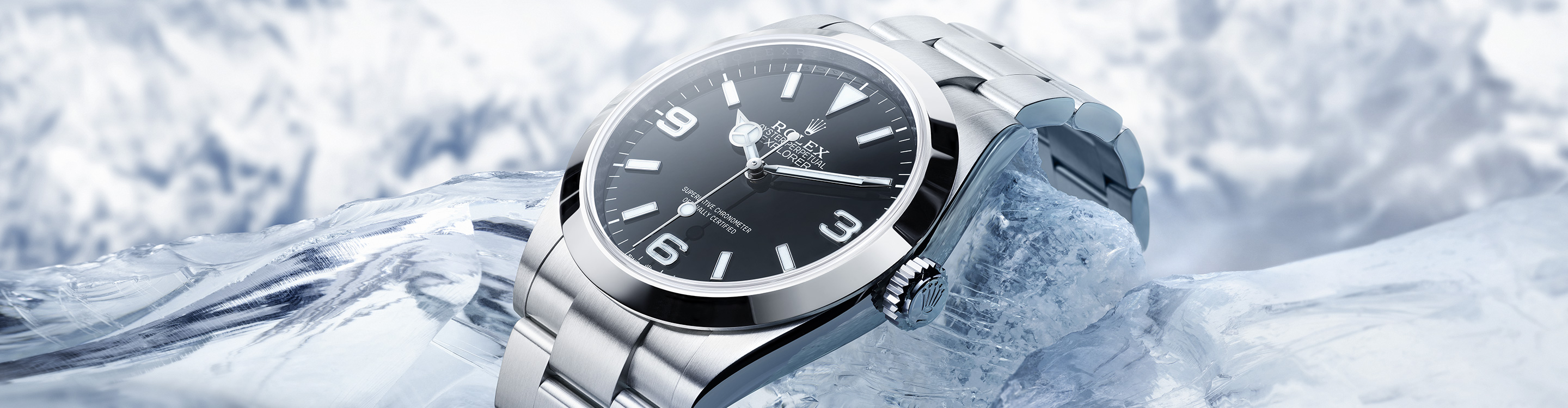 Rolex Explorer silver watch with black dial, on ice