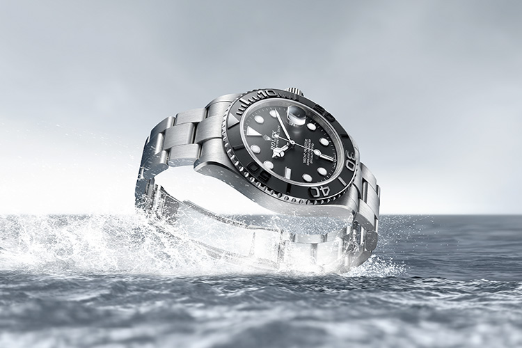 Rolex Yacht Master silver watch with black dial in water
