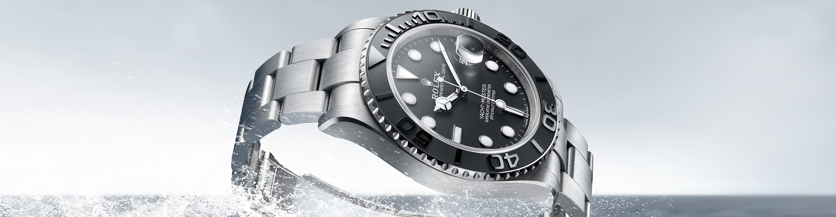Rolex Yacht Master silver watch with black dial in water